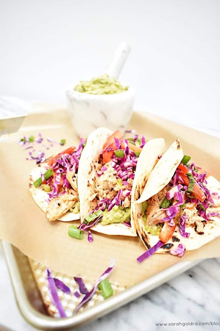 Smoky and slightly spicy chicken paired with creamy guacamole and a crunchy citrus slaw all nestled in a charred tortilla make these tacos a must for your weeknight dinner rotation or Cinco de Mayo celebrations.